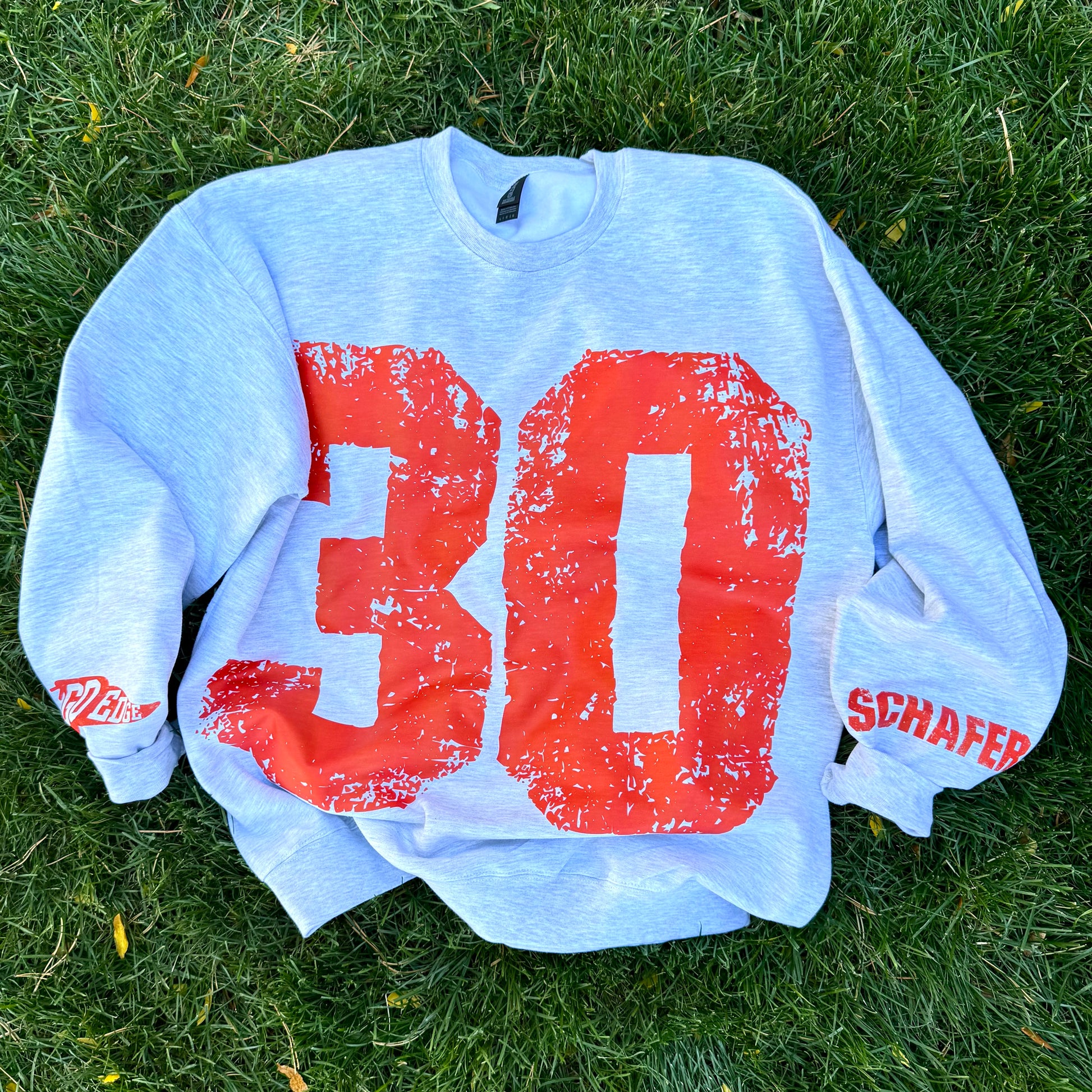 Custom #1 Fan Grunge Oversized Crewneck Sweatshirt featuring distressed vintage design with bold sporty lettering — cozy neutral game day sweatshirt perfect for personalized fan apparel or team spirit outfit.