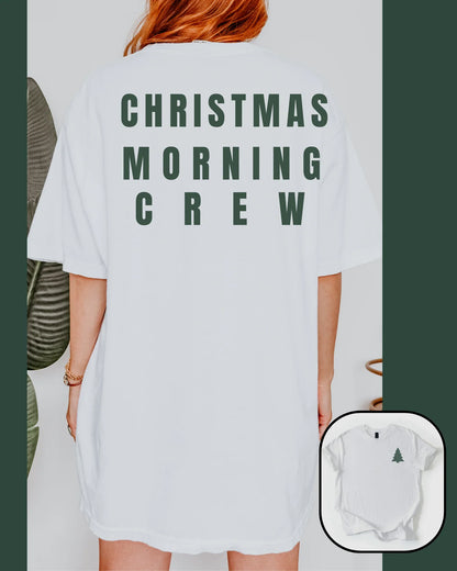Person wearing a white t-shirt with 'Christmas Morning Crew' text, with a close-up of a baby onesie below.