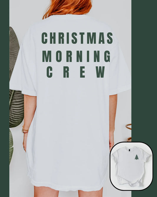 Person wearing a white t-shirt with 'Christmas Morning Crew' text, with a close-up of a baby onesie below.