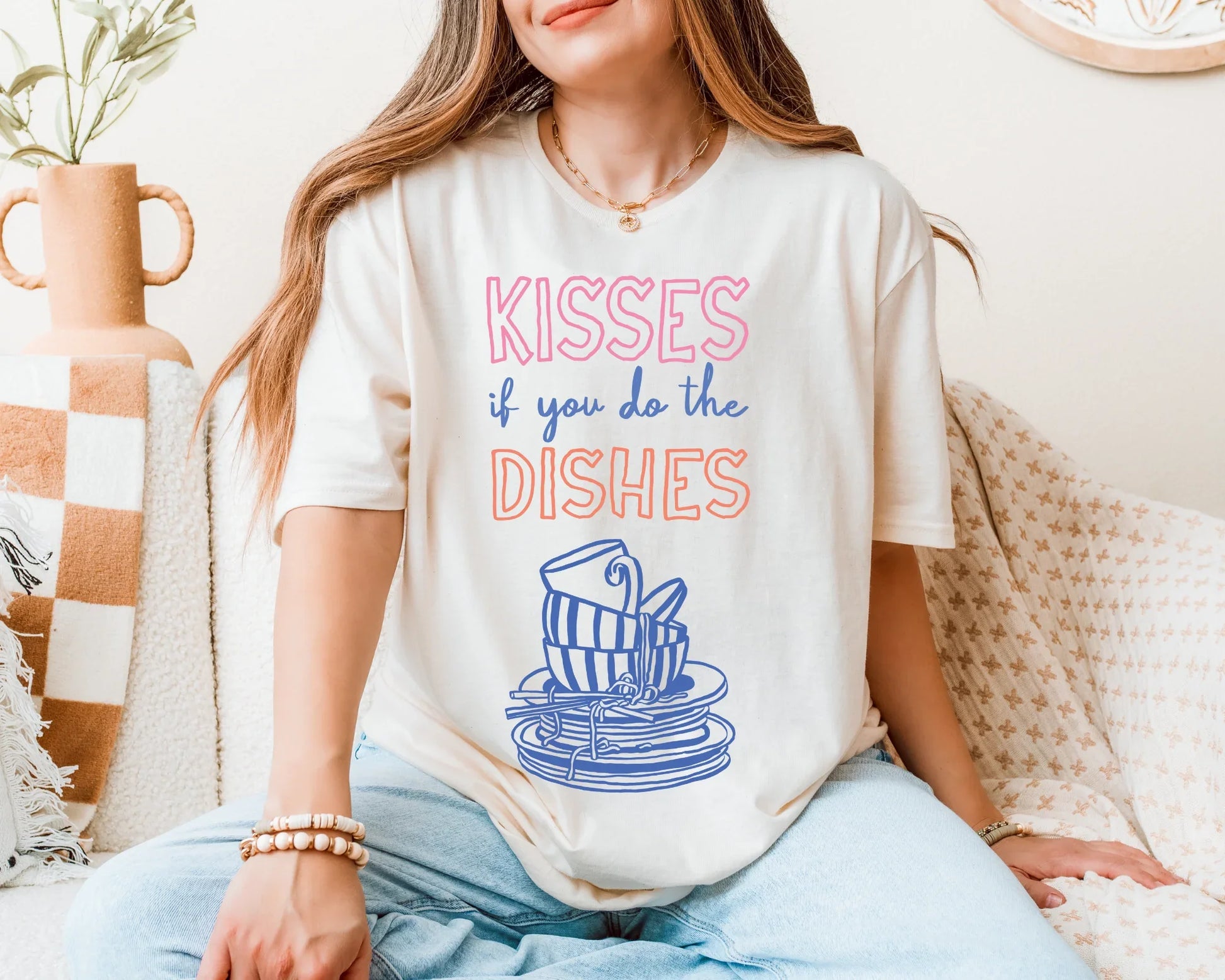 Person wearing a t-shirt with a humorous kitchen-themed design sitting on a couch.
