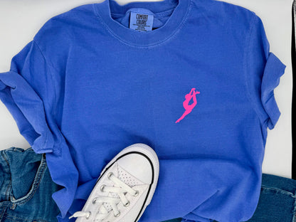 Blue tshirt with a pink logo, white sneakers, and jeans on a white background