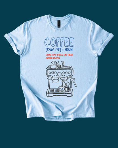 Light blue t-shirt with coffee-themed graphic and definition on a dark blue background