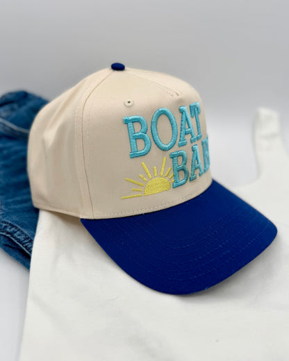 Beige and blue cap with 'BOAT BAY' text on a white background