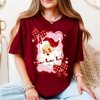 Person wearing a red t-shirt with a Christmas-themed design featuring a gnome and text.