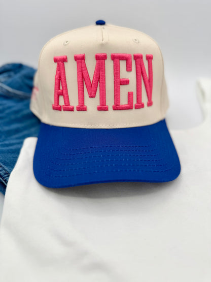 Cap with 'AMEN' in pink on a blue and beige background