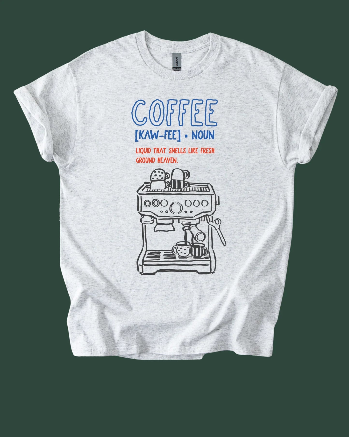 White t-shirt with coffee-themed graphic and definition on a green background