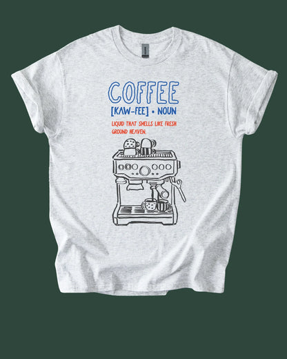 White t-shirt with coffee-themed graphic and definition on a green background