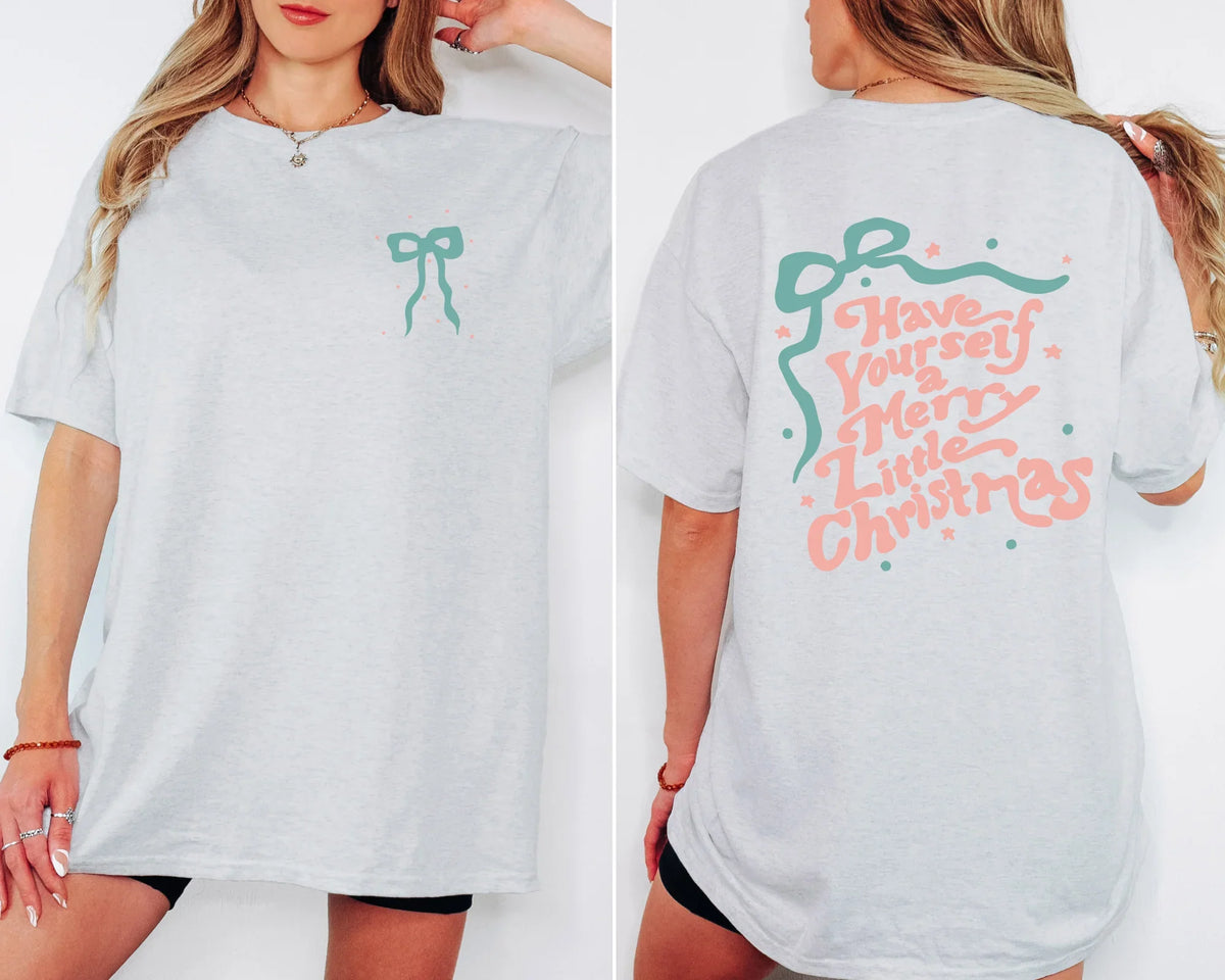 White t-shirt with festive designs on front and back worn by a person.