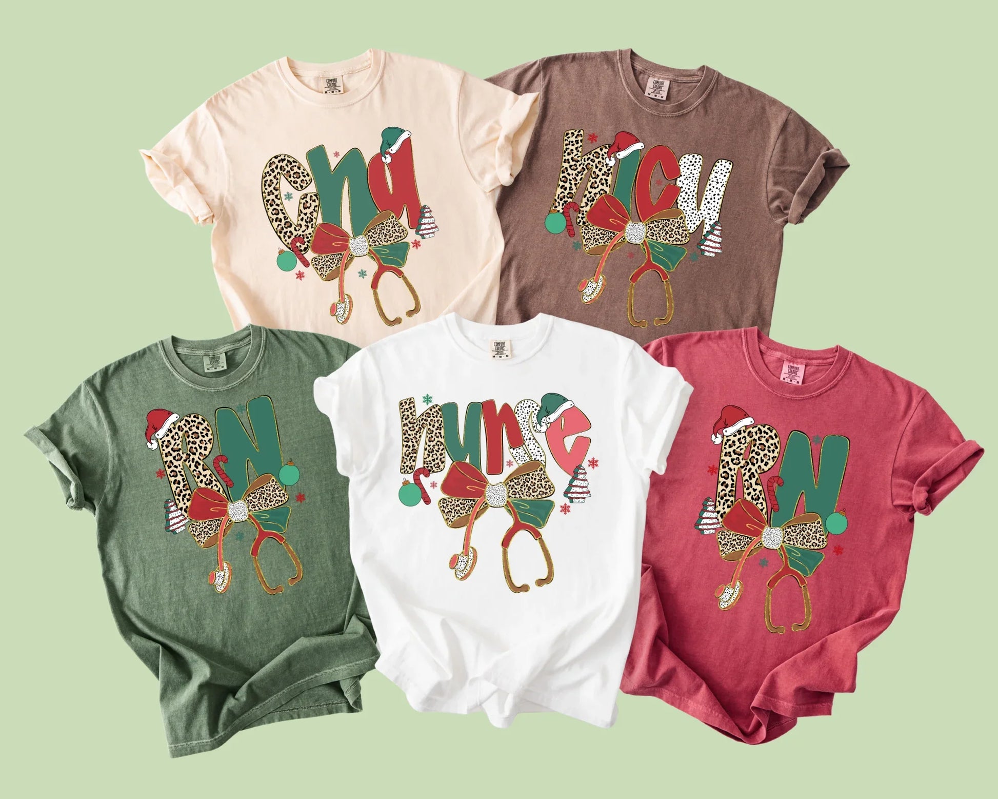Five colorful t-shirts with festive designs on a light green background