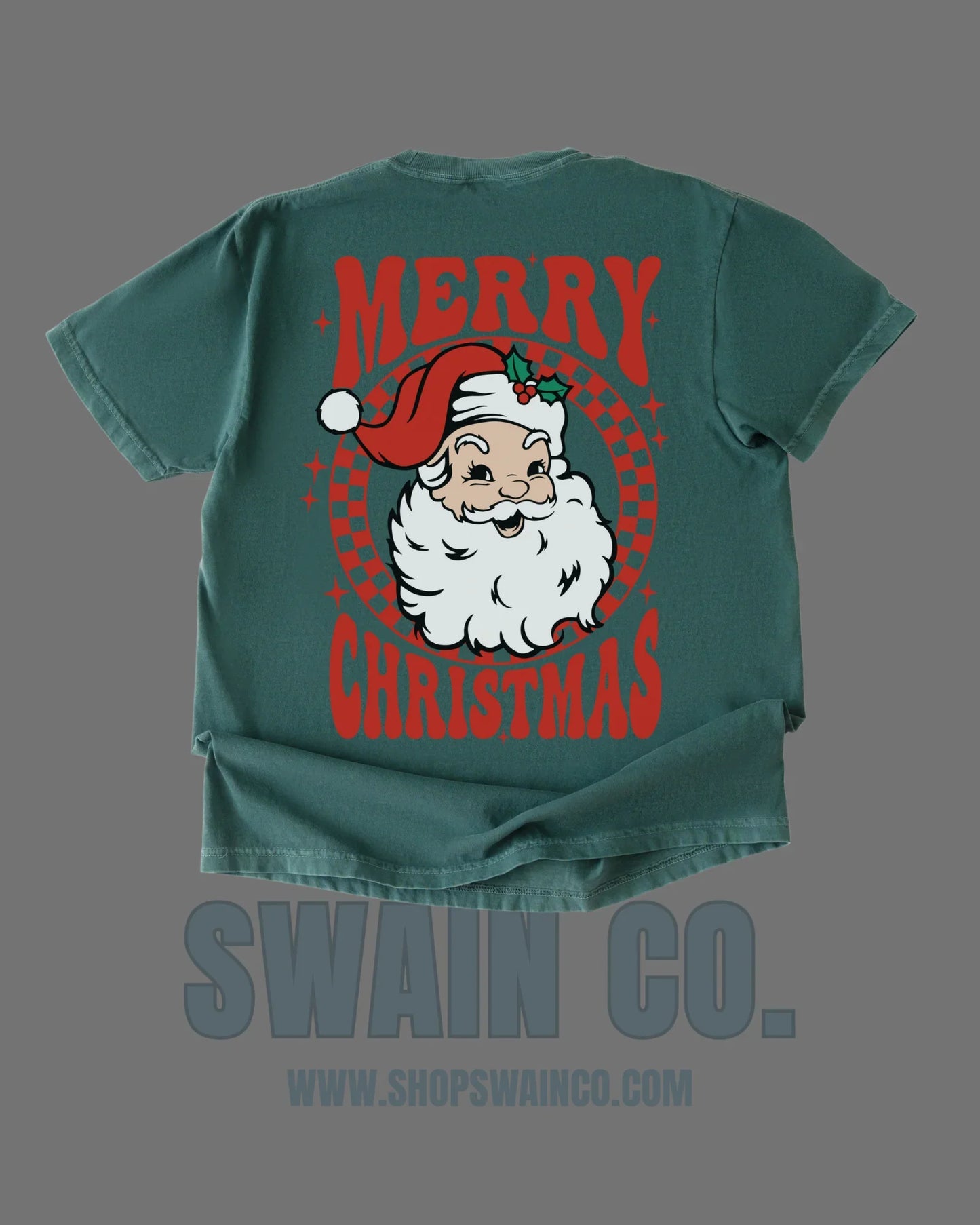 Green t-shirt with Santa Claus graphic and 'Merry Christmas' text on a gray background
