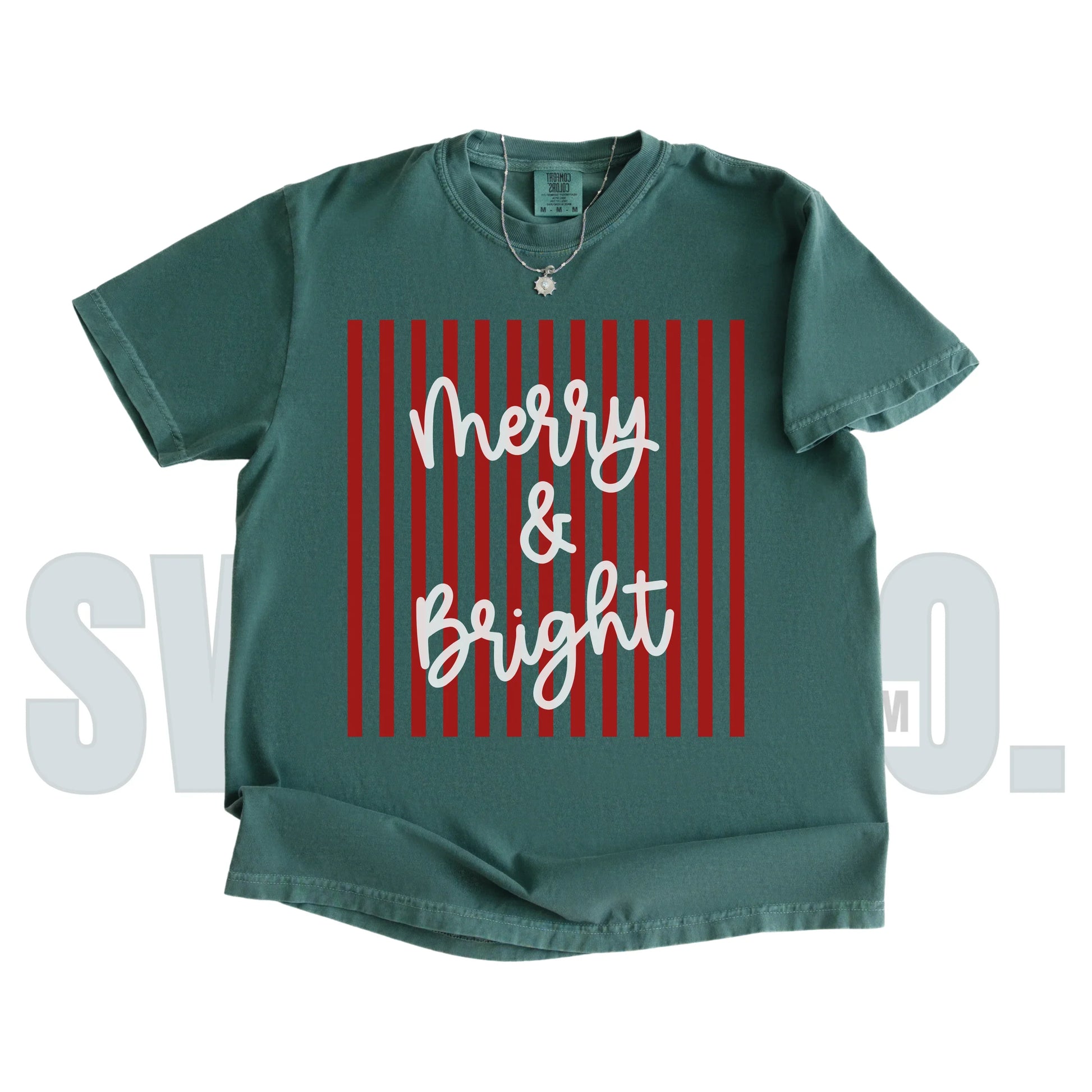 Green t-shirt with 'Merry & Bright' text on a red striped background