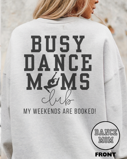 Gray sweatshirt with 'Busy Dance Moms Club My Weekends Are Booked!' text on the back, worn by a person.