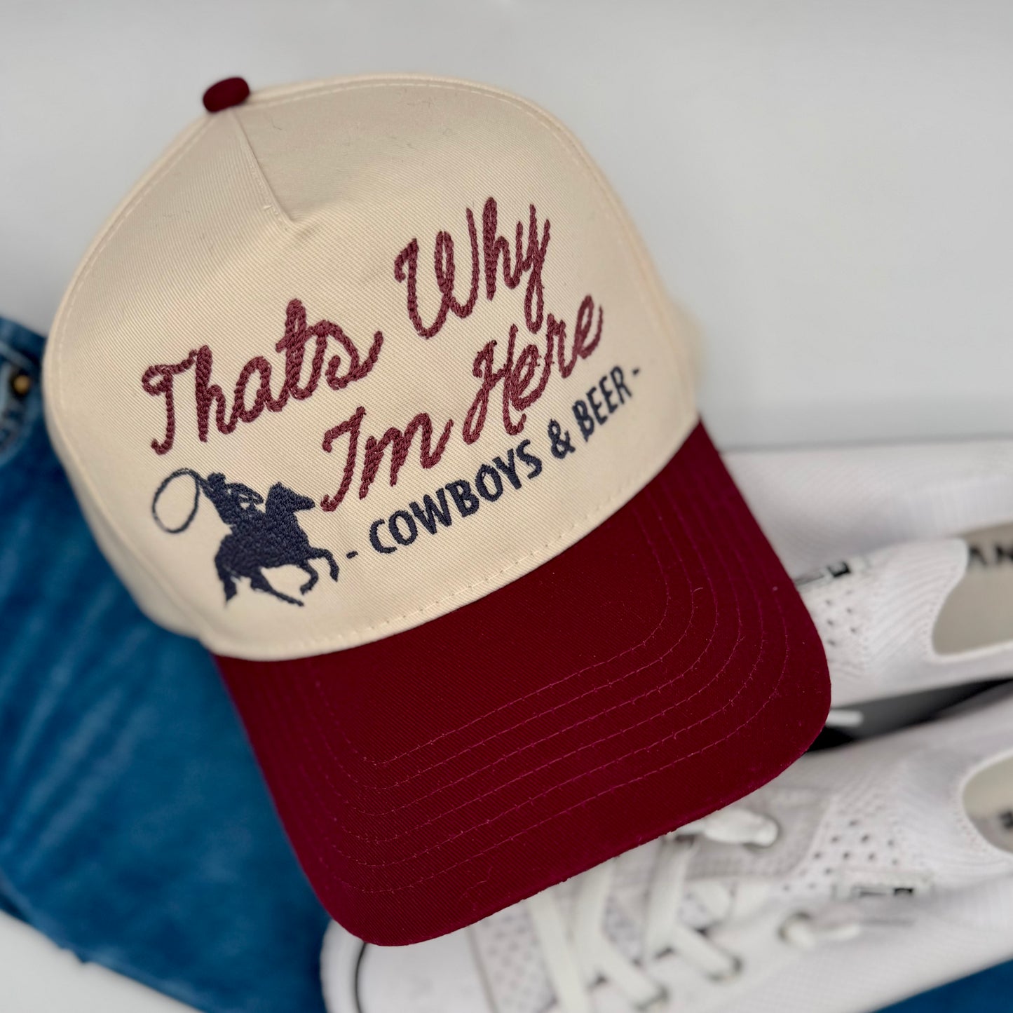 Cap with text 'That's Why I'm Here - Cowboys & Beer' on a white background