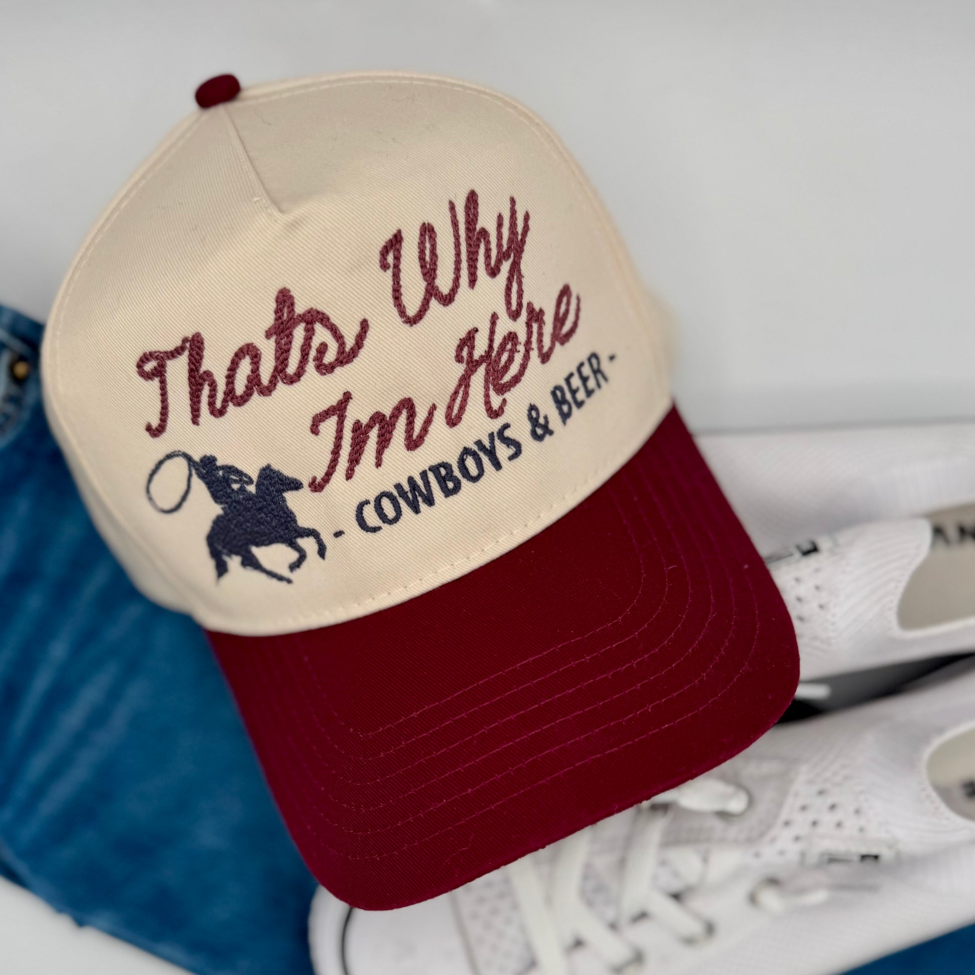 Cap with text 'That's Why I'm Here - Cowboys & Beer' on a white background