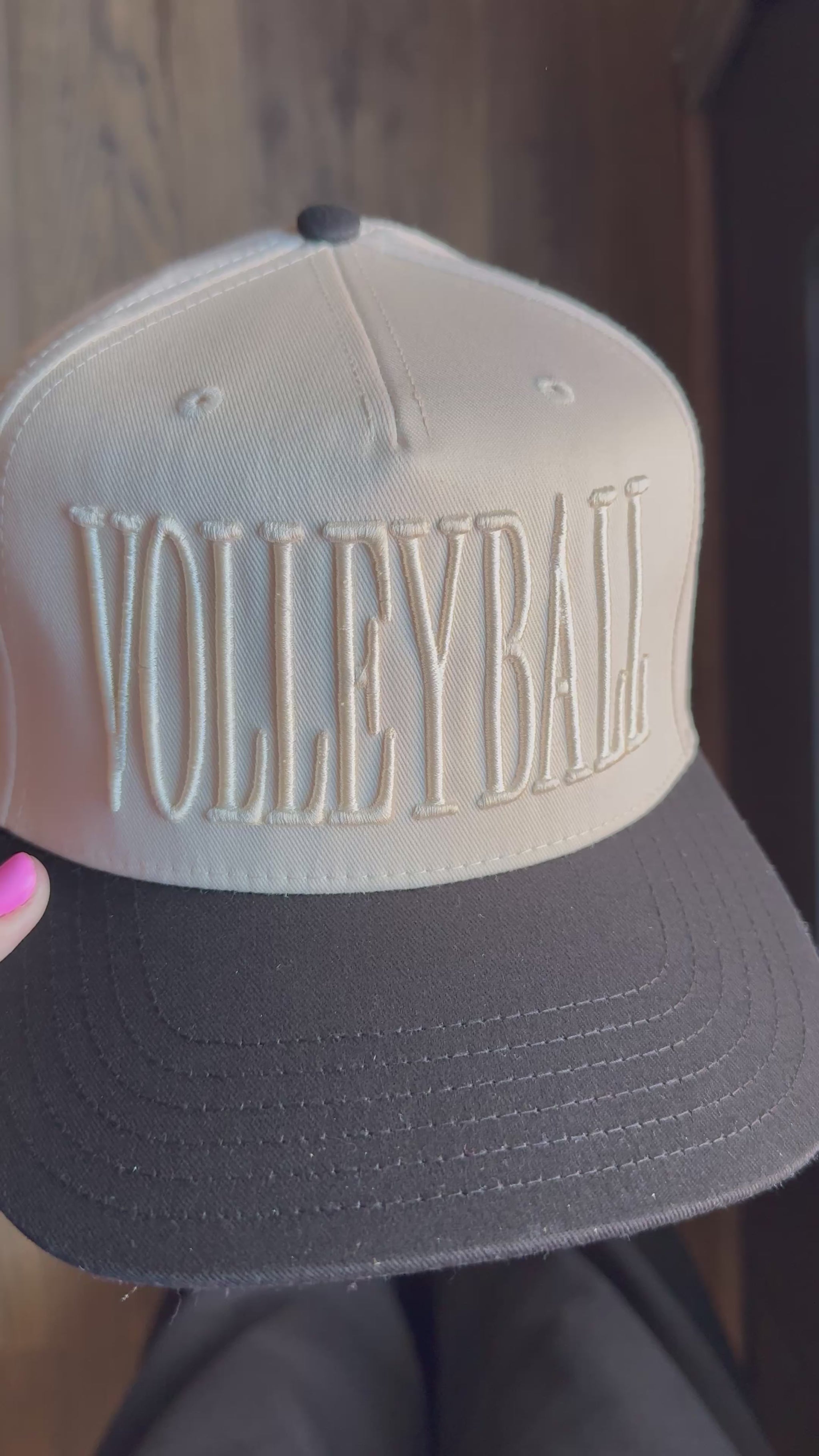 Video showing monochromatic hat with VOLLEYBALL across the front.